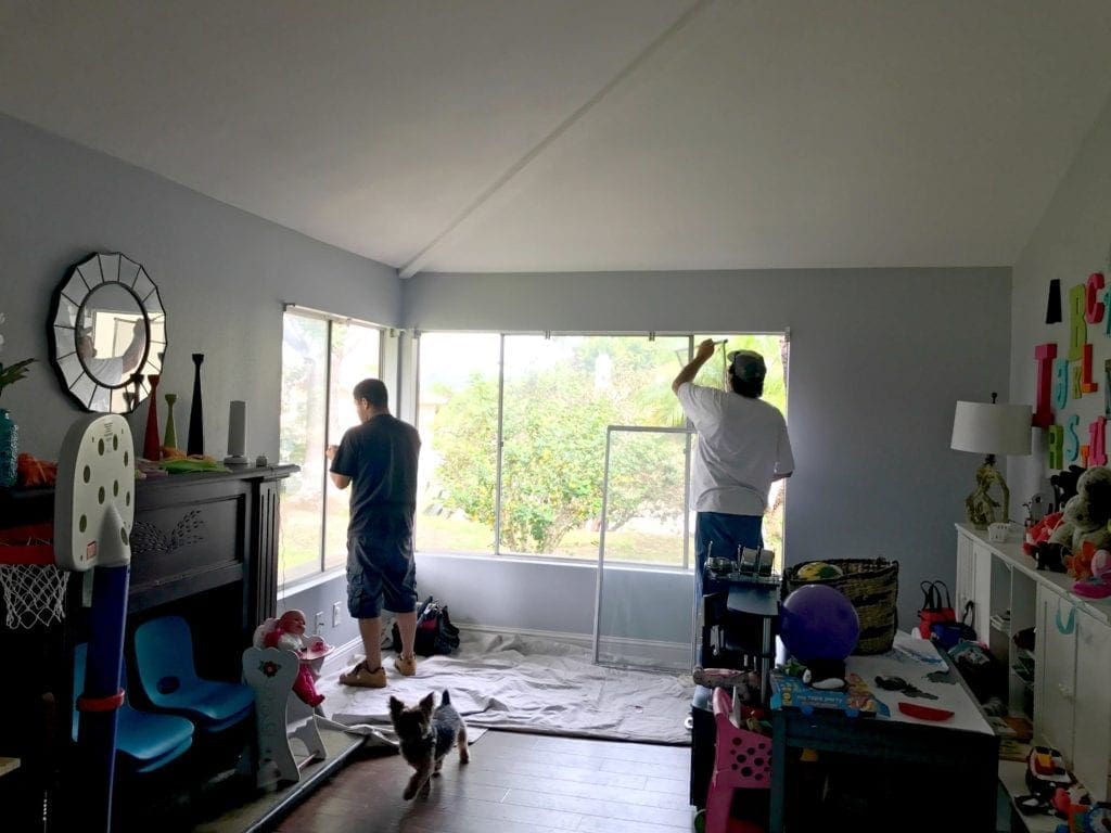Before and after photos of our window replacement home improvement project. Not a DIY job for us but worth every penny of the cost. We went with vinyl windows instead of wood, and replaced the slider and screen instead of putting in french doors. Read the five biggest lessons we learned. #homeimprovement #diyproject #windows #interiordesign #investment #homedecor #beforeandafter 