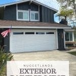 Dark gray house color with white trim and wood accents. Board and baton siding with stucco and an orange front door. See the before and after house painting transformation.